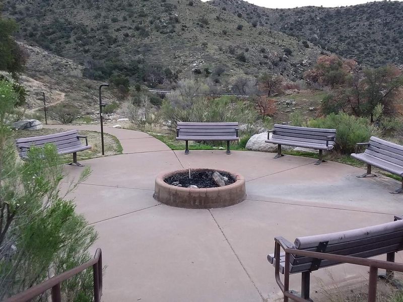 Group area with multiple benches and a firepit.