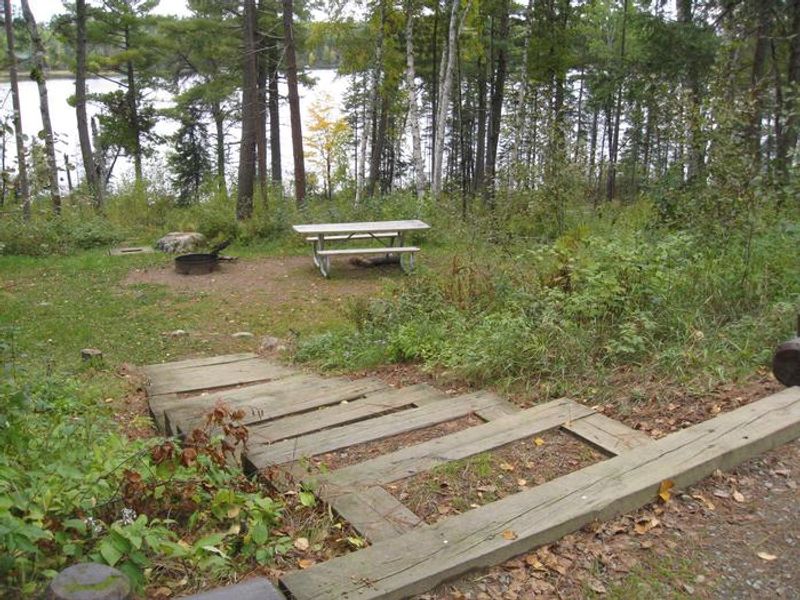 Typical campsite near South Kawishiwi River.  Most sites offer parking spur for vehicle and trailer.  Other campsite facilities may be accessed via level ground or stairs.