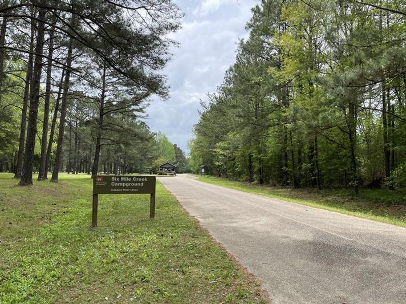 A photo of facility SIX MILE CREEK with Boat Ramp, Picnic Table, Electricity Hookup, Fire Pit, Shade, Waterfront, Lantern Pole, Water Hookup, Lean To / Shelter