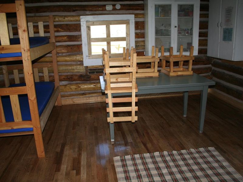 interior - bunkbed, table, cabinets