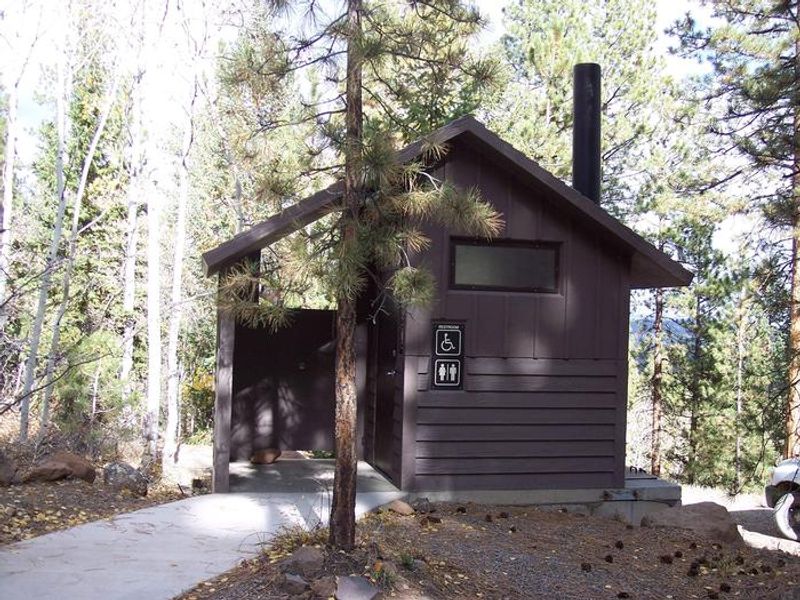 Accessible vault toilet across from campsite 16