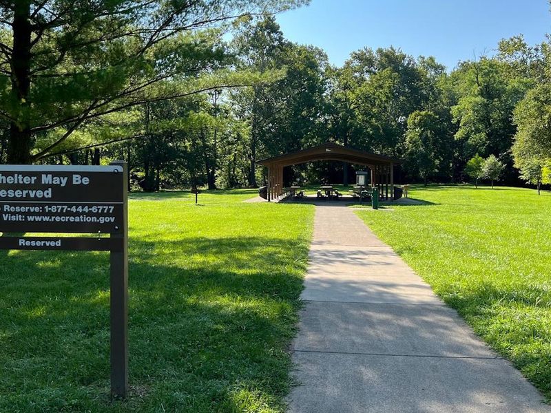 Doe Shelter, adjacent to a large shaded playground. This shelter does provide electric.