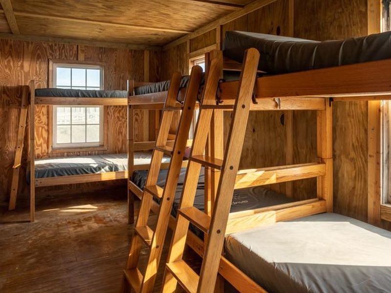 A view of the bedroom area in one of the cabins