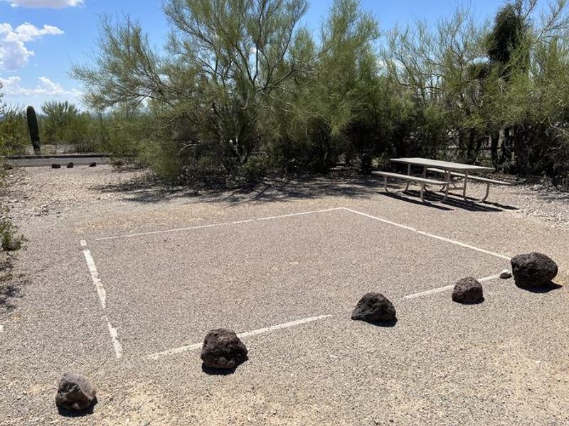 A tent pad and picnic table at a tent site at TWIN PEAKS CAMPGROUND
