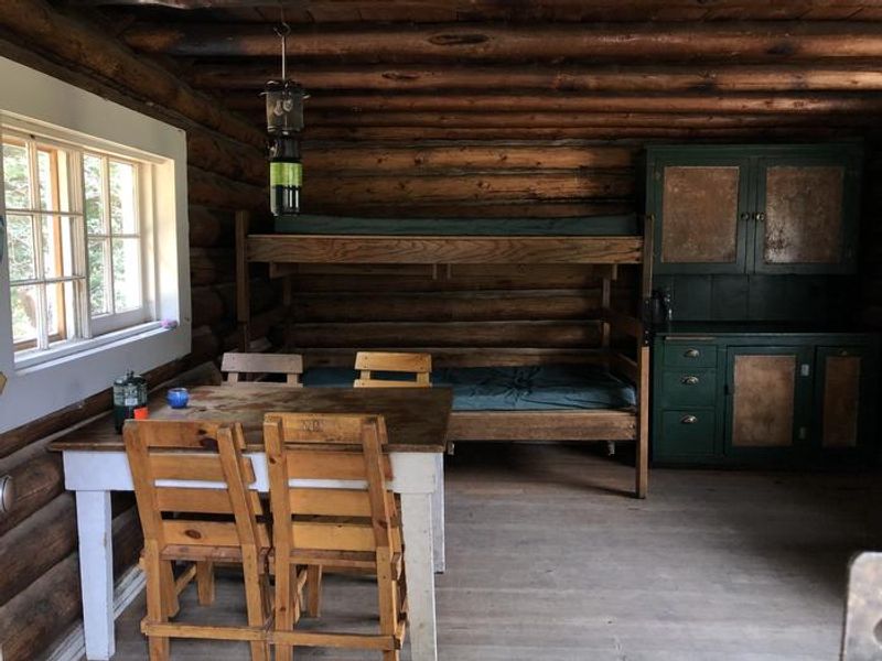 Cabin interior - two beds downstairs and two more in the loft.