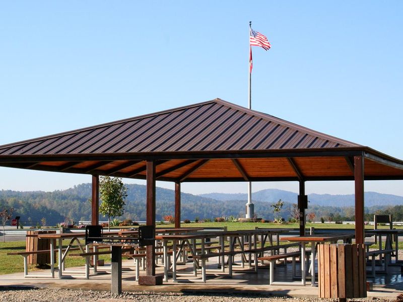 Staff photo of shelter with flagpole in background. 