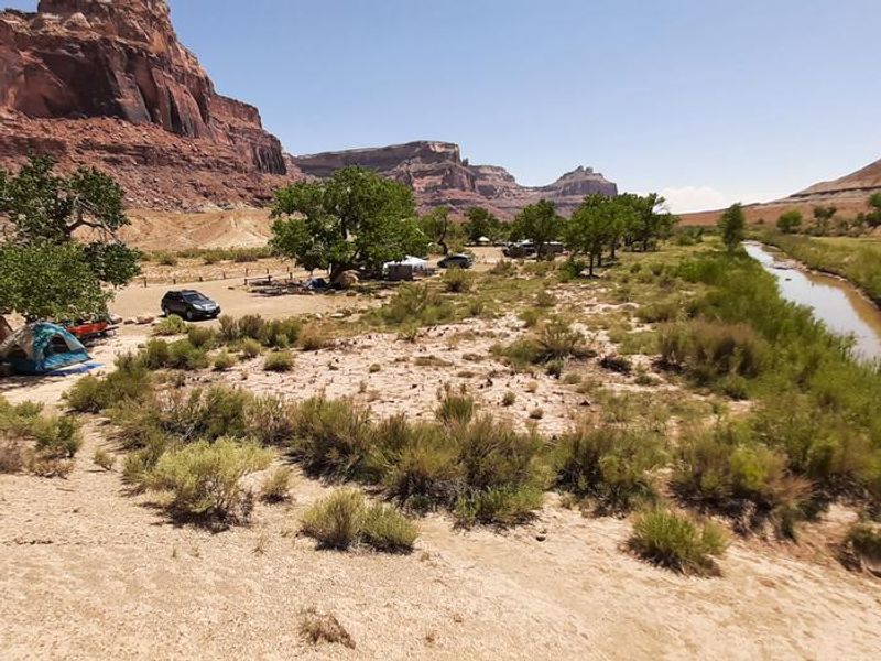 Cars, and tents in the campground located close to the San Rafael River
