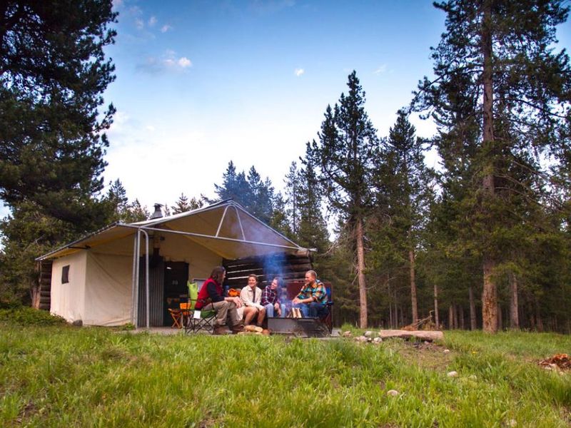The vast Colter Bay Tent Village at Colter Bay Village is set amidst towering lodgepole pines just a short, picturesque stroll away from Jackson Lake. 
