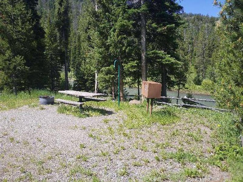 Threemile Campground campsite with river in background