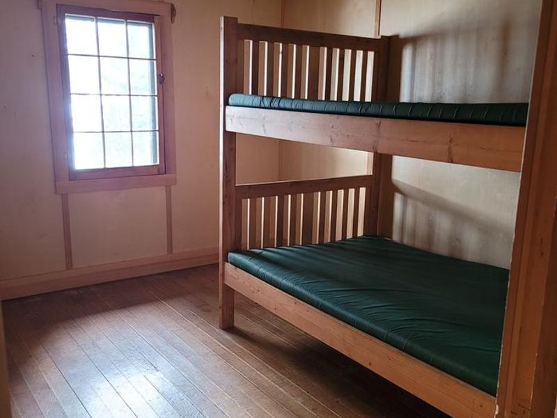 The cabin features 3 bedrooms, all with full sized bunkbeds.