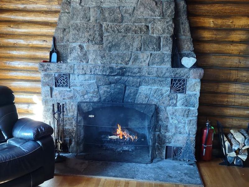 Redfeather Ranger Cabin Stone Fireplace. 