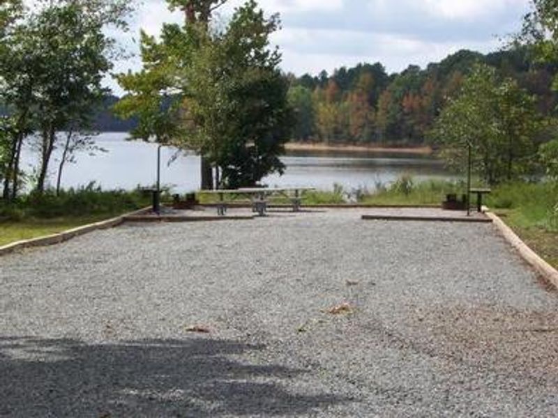 This is a picture of a double site. This site does not have electricity or water. Most campsites are graveled. This campsite has double of everything. 