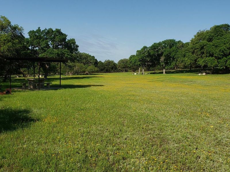 Field is near sites 1 through 6. Great spot to play games with kids or lay out and watch the stars at night.