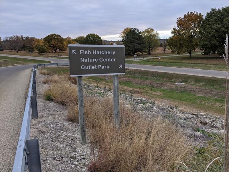 Sign showing directions to the Nature Center, Fish Hatchery and Outlet Park