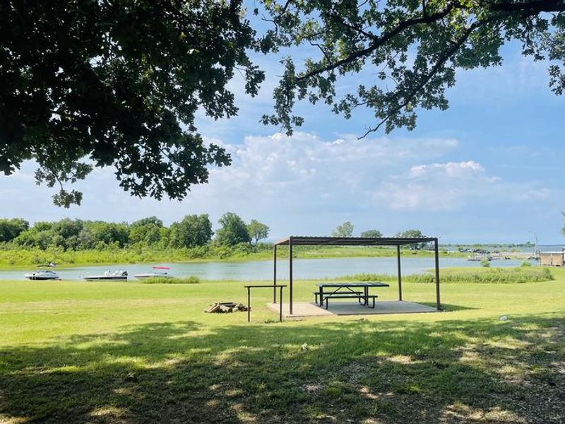 A photo of facility LAKESIDE (OK) with Picnic Table, Shade, Waterfront, Water Hookup