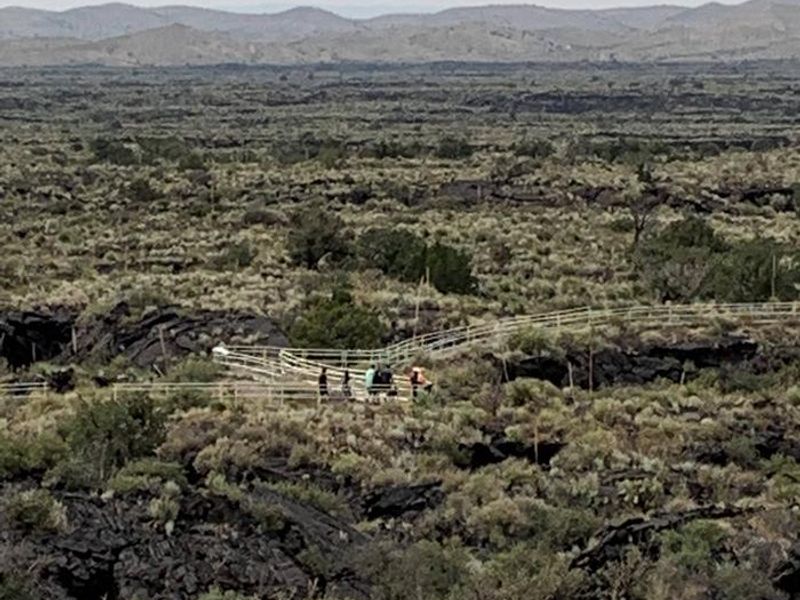 Hikers enjoying a walk around the Malpais Nature Trail