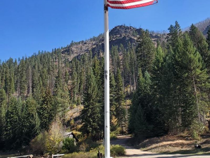 American flag at Magruder Ranger Station.  Magruder Ranger House in the background.