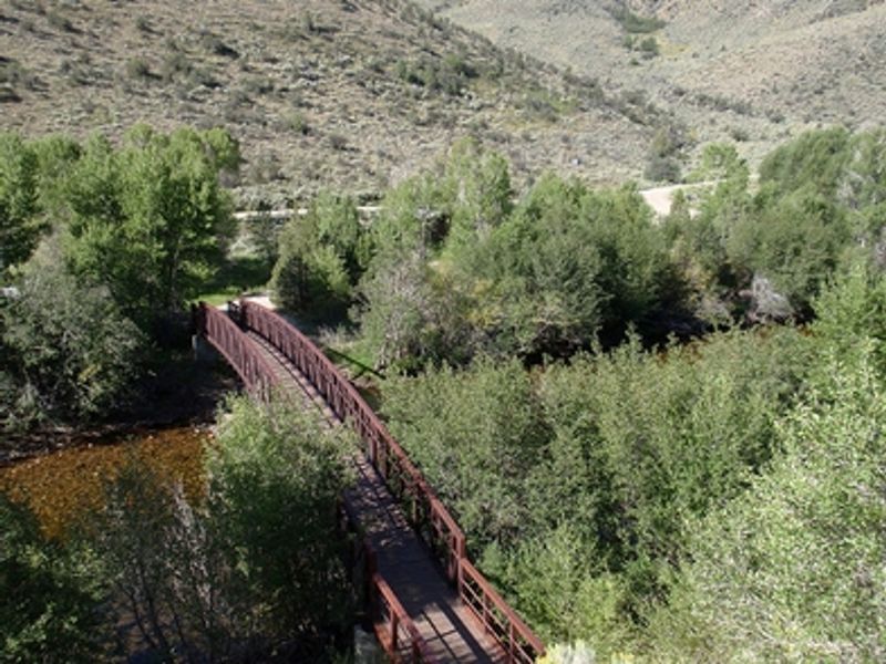 A bridge spans the Encampment River.