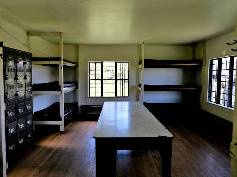Each cabin is equipped with 12 padded bunks, one long dining table, and a system of lockers for assignment of wood. Not pictured in the kitchen: wood stove, propane stove, and sink.