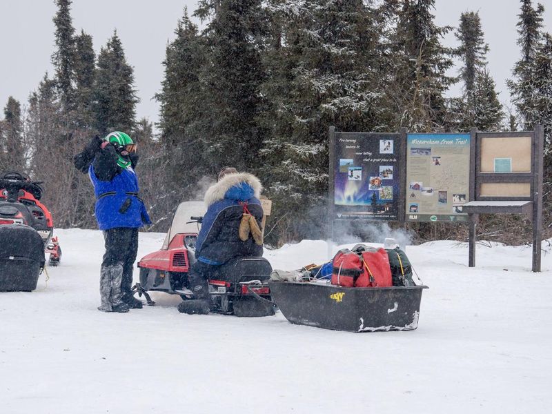 White Mountains visitors prepare to depart Wickersham Dome Trailhead.
