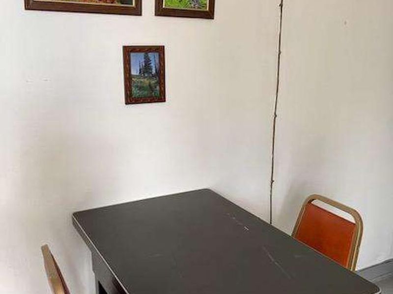 The kitchen table and photographs taken on the district. 