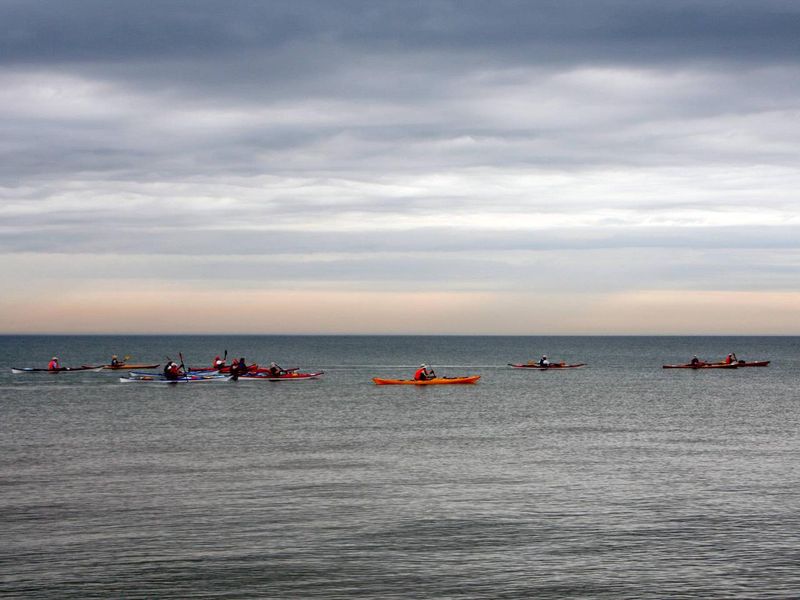 Kayakers on Lake Michigan along the Indiana Dunes National Park.