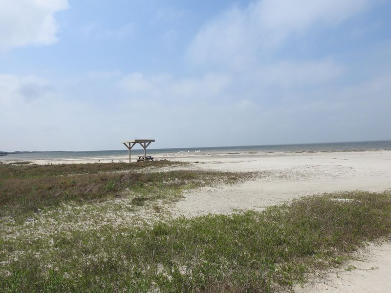 A flat sandy area that juts out into laguna Madre is a place for tent campers to set up camp and day users to fish.