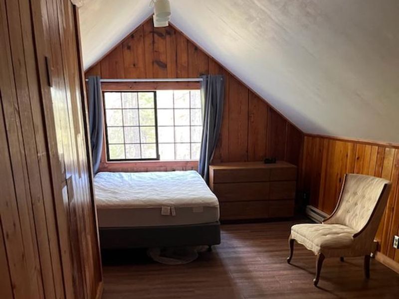 A view of the larger of the two upstairs bedrooms