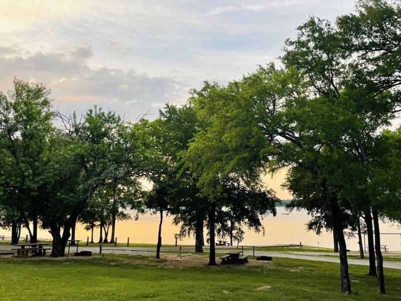 A photo of facility JUNIPER POINT with Picnic Table, Electricity Hookup, Fire Pit, Shade, Waterfront