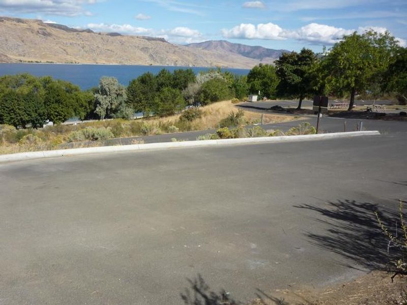 Spring Canyon overlooking groupsite. Trees and lake in the distance.