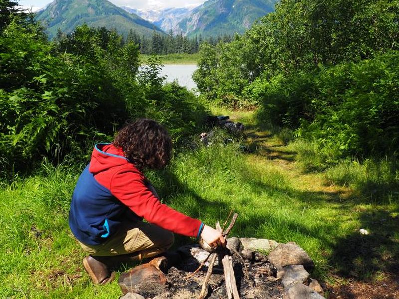 Building a fire in front of Shakes Slough 1 Cabin 