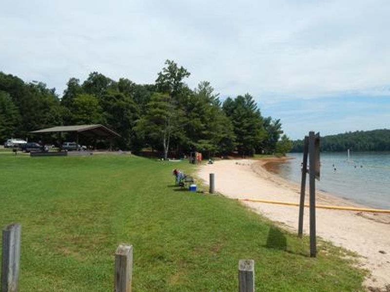 Beautiful grass, sandy beach and swim area at Goose Point