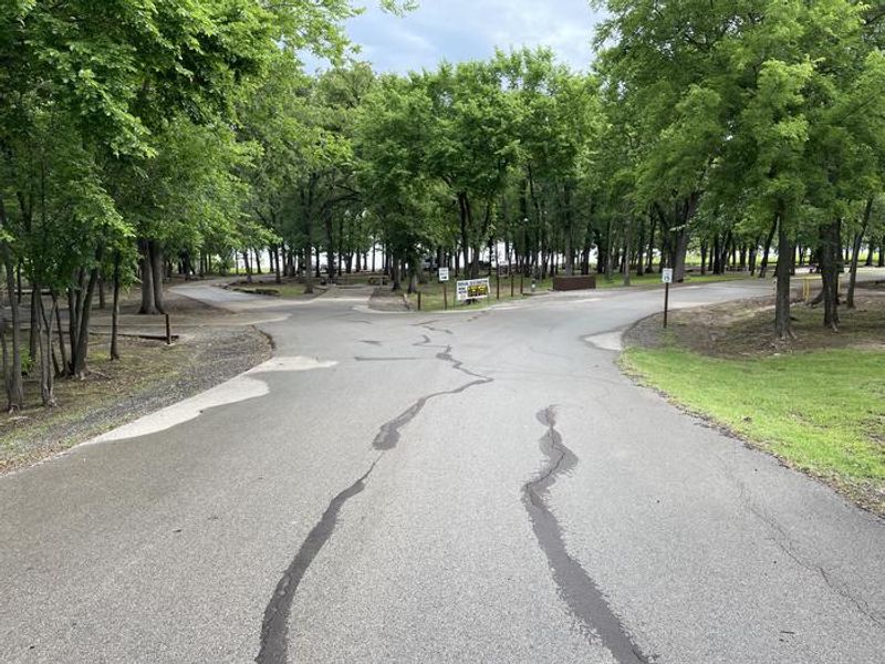 A photo of facility McFadden Cove with Boat Ramp, Picnic Table, Electricity Hookup, Fire Pit, Shade, Tent Pad, Waterfront, Water Hookup