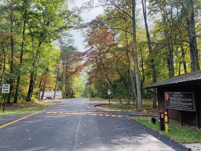 Entrance Station is the brown building to the right, then on past the station is the dump station, and potable water hookup.