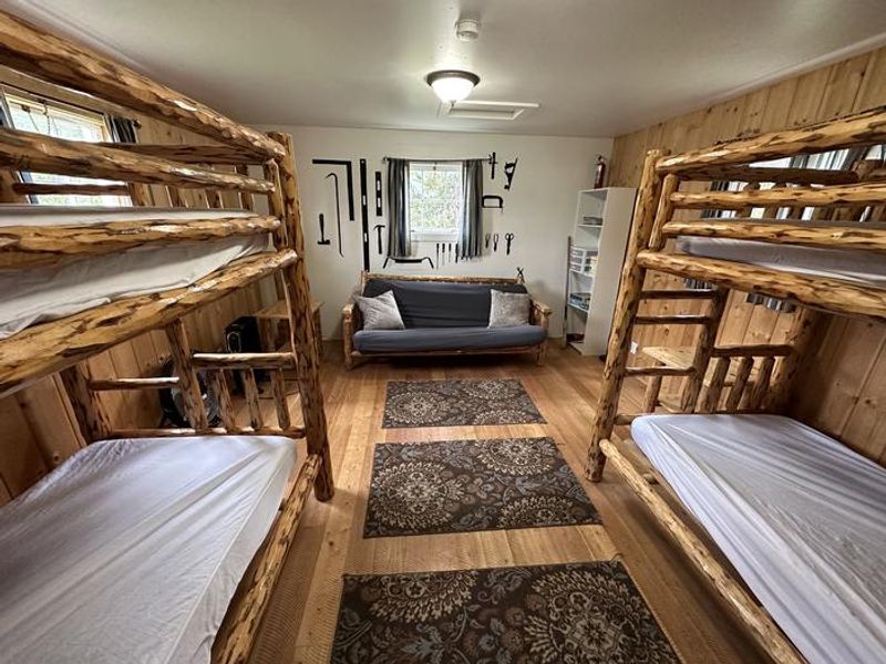 Star Meadow Guard Station bunkhouse with two bunkbeds and a futon couch. Sleeps 6, great for the kids!