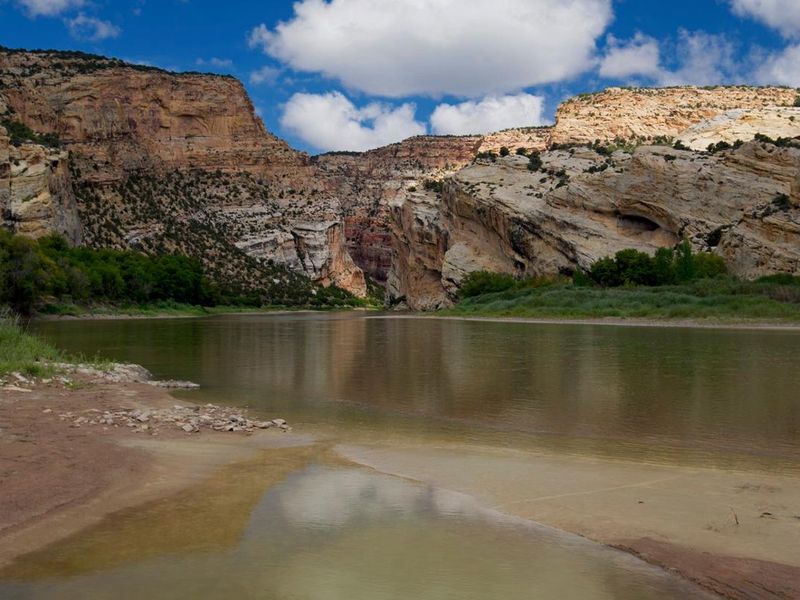 The Deerlodge Park Area showing red rock cliffs and the Yampa River at the head of Yampa Canyon