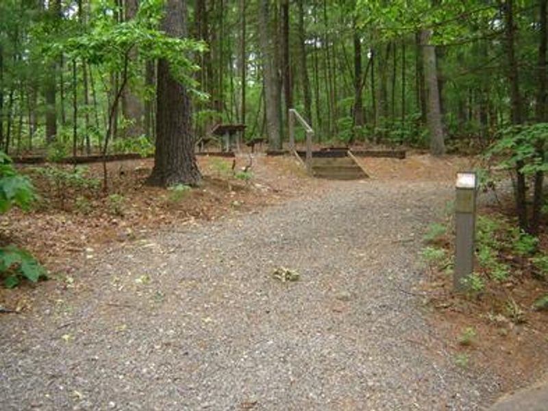 Campsite parking spur with steps to camping area.