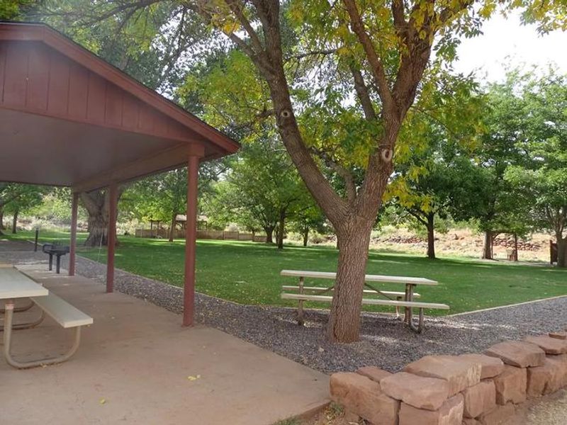 The Group Site includes two covered pavilions, designated tent pads, restrooms, grills, fire pits, and an outside sink.