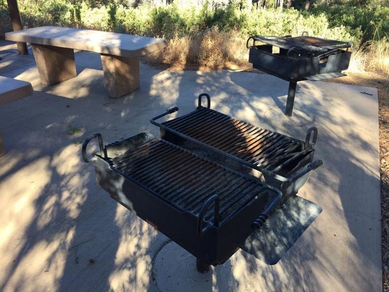 2 large charcoal grills provided, bring your own wood or charcoal 