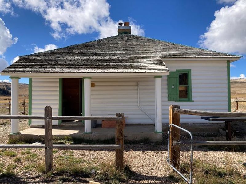 Seely Creek Guard Station exterior, back door and yard