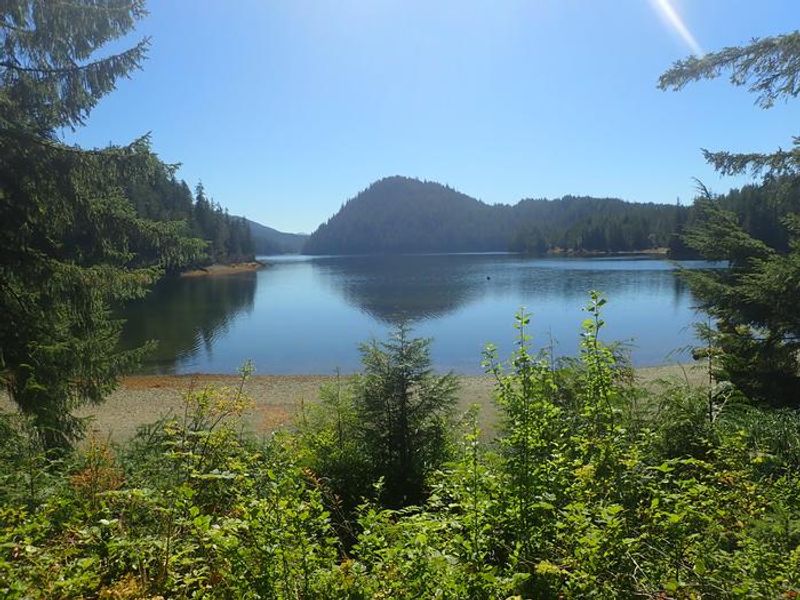 View from deck of cabin, with beach and mooring ball. 