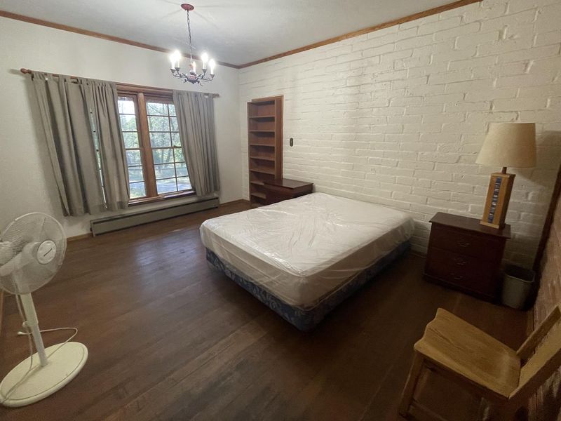 Master Bedroom of Half Moon Ranch furnished with queen bed and side tables.