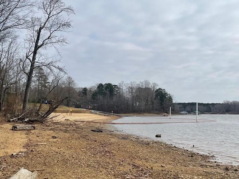 Welcome to Grassy Creek! This is a photo of the large and sandy designated swimming area. The swimming area has a life jacket loaner station where you can borrow a life jacket for the day. Don't forget to return the life jacket to the loaner station when you are done for the day. 
