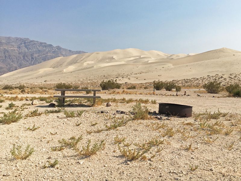 Primitive campsite with view of sand dunes