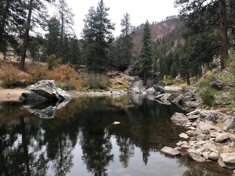Swimming and fishing hole located on the river adjacent to the campground