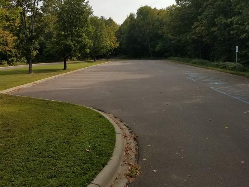 Parking area for the Clark Lake pavilion and day use area, from the western end of the parking area.