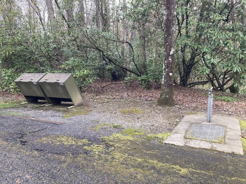 Water spigot and trash receptacles located conveniently throughout campground