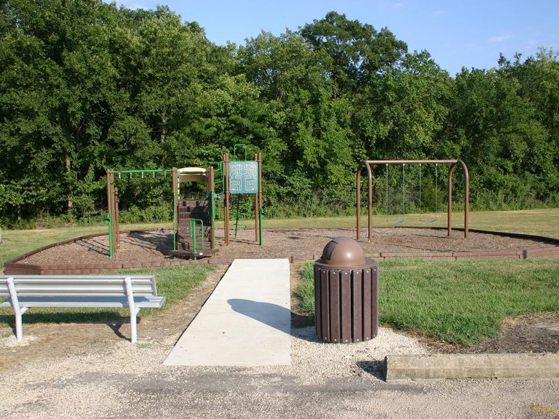A modern playground is located within the Bloomington West campground