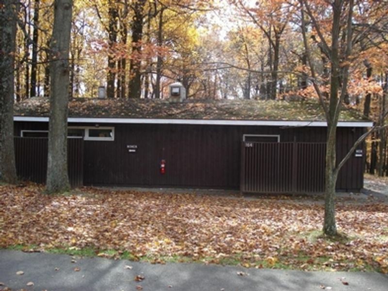Campers shower in one of the central shower buildings