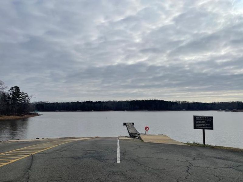 Welcome to Grassy Creek. This is a photo of the boat ramp. The ramp has two lanes and a wooden dock to walk out on. Fishing and diving is not allowed on the ramp. 